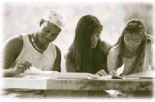 Photograph of three people reading books.